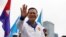 FILE - Hun Manet, son of Cambodia's Prime Minister Hun Sen, waves to people during the final Cambodian People's Party (CPP) election campaign for the upcoming general election in Phnom Penh, Cambodia, July 21, 2023. 