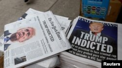 New York newspapers are displayed at a newsstand following former U.S. President Donald Trump's indictment by a Manhattan grand jury following a probe into hush money paid to porn star Stormy Daniels, in New York, March 31, 2023.