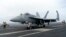 Chiến đấu cơ F-18E đậu trên sàn đáp của tàu sân bay USS Theodore Roosevelt hôm 11/4 trong cuộc tập trận hải quân của Mỹ, Nhật Bản và Hàn Quốc tại Biển Hoa Đông trong bối cảnh căng thẳng từ Trung Quốc và Triều Tiên.