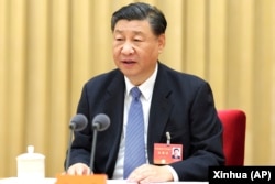 中国领导人习近平在北京举行的年度中央经济工作会议上讲话。(2023年12月12日)