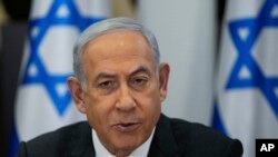 资料照片:以色列总理内塔尼亚胡12月24日在以色列特拉维夫的以色列国防部所在地基里亚军事基地主持内阁会议。(美联社照片)