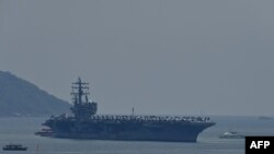 The USS Ronald Reagan, a US Navy Nimitz-class nuclear-powered aircraft carrier, pulls into port in Danang on June 25, 2023.