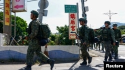 士兵们在台湾桃园参加一年一度的汉光军演的第一天。(2024年7月22日)