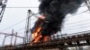 Flames and smoke rise from a blaze at an electricity facility after a Russian attack in Kharkiv, Ukraine, March 22, 2024. Attacks on energy facilities in the Kharkiv region caused blackouts and disrupted critical air-raid siren systems.