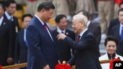 Chủ tịch Trung Quốc Tập Cận Bình và Tổng Bí thư Nguyễn Phú Trọng, Hà Nội, ngày 12/12/2023. (Nhac Nguyen/Pool via AP)