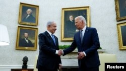 2024年7月25日,美国总统拜登在白宫椭圆形办公室会见以色列总理内塔尼亚胡。(路透社照片)