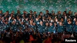 2024年1月13日,台湾当选总统赖清德和他的竞选伙伴萧美琴在台北参加总统选举胜利后的集会。(路透社)