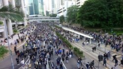 FILE - An estimated 800,000 protesters flock to the streets of Hong Kong to mark the six-month anniversary of the anti-government movement sparked by a controversial extradition law, Dec. 8, 2019.