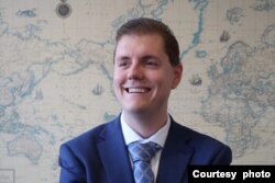 “国际税务和投资中心”国际项目部主任何伟龙。(照片由本人提供)