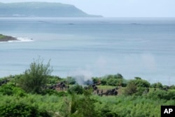 台湾军队在屏东枫港举行重炮实弹射击演练。(2022年8月9日)