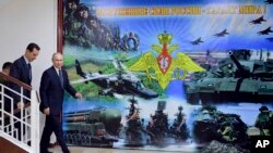 资料照片:叙利亚总统巴沙尔·阿萨德在大马士革与俄罗斯总统弗拉基米尔·普京交谈。(2020年1月7日)