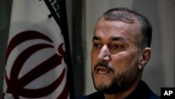 Iran's Foreign Minister Hossein Amir-Abdollahian speaks during a news conference with his Lebanese counterpart Abdallah Bouhabib in Beirut, Lebanon, March 24, 2022.