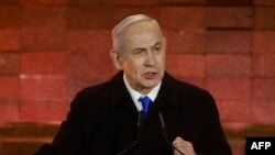 以色列总理本雅明·内塔尼亚胡(Benjamin Netanyahu)星期日(2024年5月5日)在以色列犹太人大屠杀纪念馆的一项纪念活动上发表讲话。(法新社)