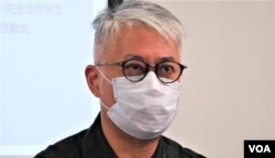 时事评论员黄伟国表示,李家超得票率超过99%与全票分别不大, 他不认为北京故意安排12名选委投不支持及白票,结果反映北京施压下,建制派团结只是假像。 (美国之音/汤惠芸)