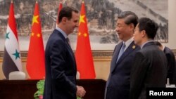 资料照:中国领导人习近平在杭州会晤到访的叙利亚总统阿萨德。(2023年9月22日)