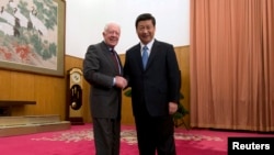 资料照:中国领导人习近平在北京中南海会见到访的美国前总统卡特。( 2012年12月13日)