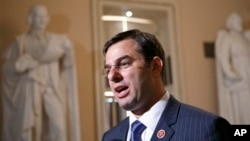 Джастін Амаш