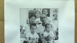 中国维权志愿者们向民主国家驻中国大使和外交机构发出的声援呼吁书上印有王藏一家的照片。(志愿者提供图片)