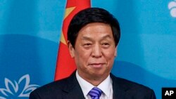 中共中央政治局委员栗战书在符拉迪沃斯托克会见俄罗斯总统普京。(2022年9月7日)