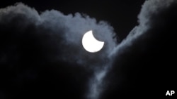 Clouds shield the solar eclipse in Kosovo village of Laplje Selo, March 20, 2015