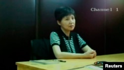 谷开来在法庭上(2013年8月23日,济南中级法院发布的视频的截图)