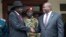 Presiden Sudan Selatan Salva Kiir, kiri, dan Wakil Presiden Pertama Riek Machar, kanan, berjabat tangan setelah pertemuan di Juba, Sudan Selatan, 20 Oktober 2019.
