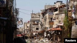 图像显示,2013年5月27日在大马士革附近地区支持叙利亚总统阿萨德政府军和反政府的自由叙利亚军的武装冲突中被摧毁的建筑物