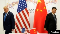资料照:2019年6月29日,美国前总统特朗普与中国领导人习近平在日本大阪出席G20国家领导人峰会期间举行双边会晤。