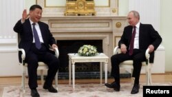 俄罗斯总统普京在莫斯科克里姆林宫会见到访的中国领导人习近平。（2023年3月20日）