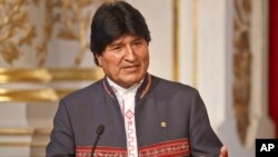 Bolivia's President Evo Morales gestures as he speaks to the media during a joint media conference with France's President Francois Hollande at the Elysee Palace in Paris, France, Nov. 9, 2015.