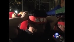 香港罢工工人冒雨抗议 香港罢工工人冒雨抗议