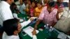Supporters of National Rescue Party gather to give their thumbprint at the party's office in Phnom Penh, Cambodia, July 31, 2013, as they complain that their names were not in the voting lists of July 28 election. 