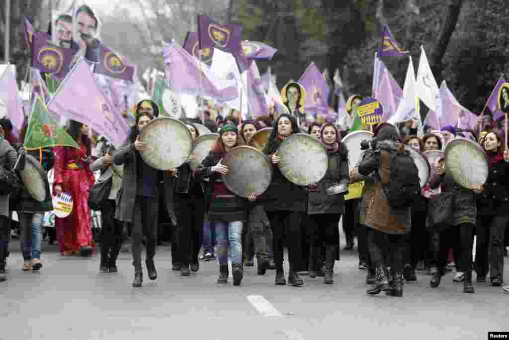 Women walk as they shout slogans during an International Women's Day rally in Istanbul, Turkey, March 8, 2015.