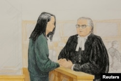 孟晚舟和她的律师2018年12月10日在法庭上