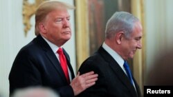 Tổng thống Mỹ Donald Trump và Thủ tướng Israel Benjamin Netanyahu tại cuộc họp báo chung về kế hoạch hòa bình Trung Đông của Tổng thống Trump tại Tòa Bạch Ốc ngày 28/1/2020. 