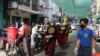 ရန်ကုန်မြို့မှာ နှာခေါင်းစည်းတပ်ပြီး ဆွမ်းခံကြွနေတဲ့ သံဃာတော်များ။