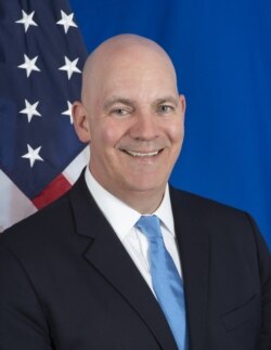 FILE - R. Clarke Cooper, Assistant Secretary of State for Political-Military Affairs, is seen in an official State Department photo.