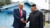 资料照：美国总统特朗普和朝鲜领导人金正恩在板门店会晤握手。（2020年1月11日）