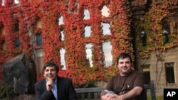 Professor Andre Geim, left, and Dr Konstantin Novoselov who have have been awarded the Nobel Prize for Physics pose for pictures outside Manchester University, Manchester, England, Tuesday, Oct, 5, 2010. The scientists shared the Nobel Prize in physics