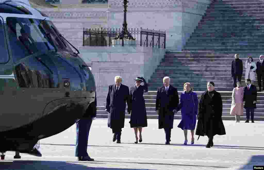 2025年1月20日，华盛顿，就职典礼当天，唐纳德&middot;特朗普总统和第一夫人梅拉尼娅&middot;特朗普与前总统乔-拜登和前第一夫人吉尔-拜登一起从美国国会大厦走出来，登上海军陆战队一号。