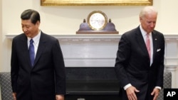 资料照:时任美国副总统拜登在白宫接待到访的时任中国国家副主席习近平。(2012年2月14日)