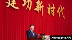 资料照:中国领导人习近平在全国政协新年茶话会上发表讲话。(2021年12月31日)