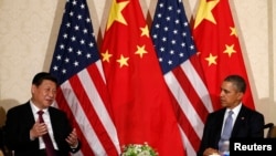 中国国家主席习近平和美国总统奥巴马在荷兰参加核安全峰会期间会晤。(2014年3月24日)