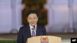 新加坡新任总理黄循财2024年5月15日晚在总统府宣誓就职。(新加坡政府照片)