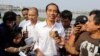 Indonesian presidential candidate Joko Widodo talks to the media during his visit at a reservoir development project in Jakarta, Indonesia, July 22, 2014.
