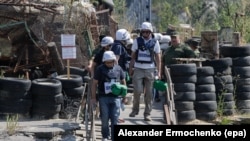 UKRAINE -- Members of the Organization for Security and Co-operation in Europe (OSCE) Special Monitoring Mission to Ukraine visits the pro-Russian rebels check point near of the Stanitsa Luhanska village of Luhansk area, Ukraine, August 19, 2017.