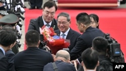 中国总理5月26日抵达首尔,在隔天举行的中日韩峰会之前,先分别和日本首相岸田文雄、韩国总统尹锡悦双边会谈。(法新社)