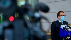 香港警方国安处高级警司李桂华星期三在记者会上。(2021年8月18日)