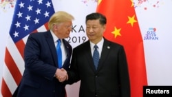 资料照:美国前总统、当选总统特朗普与中国领导人习近平在日本大阪出席G20峰会期间举行会晤。(2019年6月29日)