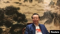 2017年3月7日在北京举行全国人大会议期间,中国华融资产管理有限公司董事长赖小民接受路透社采访。